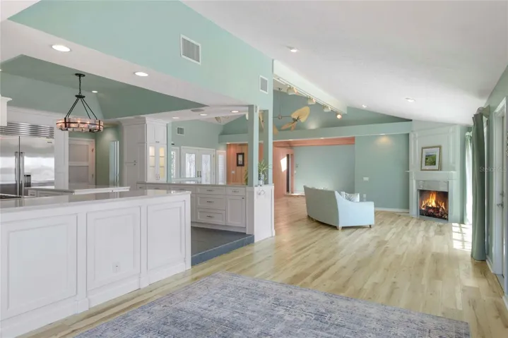 From the Florida Room and Dining Area enjoy the OPEN Floor Plan and immediate access to Kitchen and Living Spaces