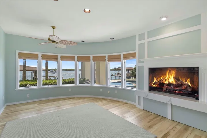 On the North side of the home, and across the pool from the Florida Room, you find the secluded waterfront Library/Office with Intracoastal Views