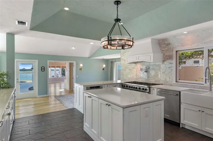 Kitchen Positioned with Pool, Intracoastal and Courtyard Views. Open to both Dining and Living Areas for Optimal Entertaining Options.