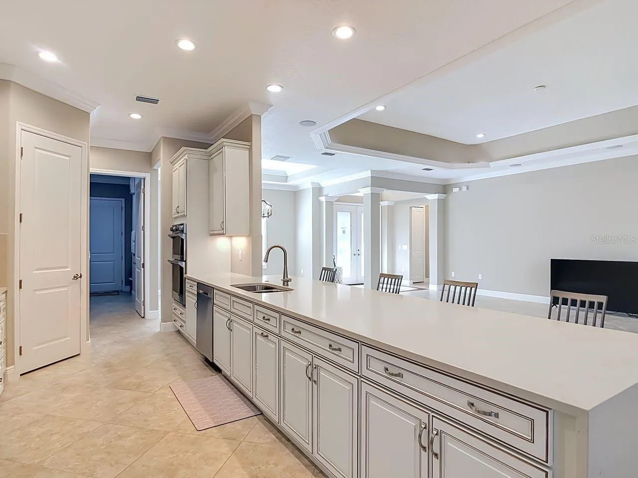 Waterfall quartz countertops, with matching backsplash