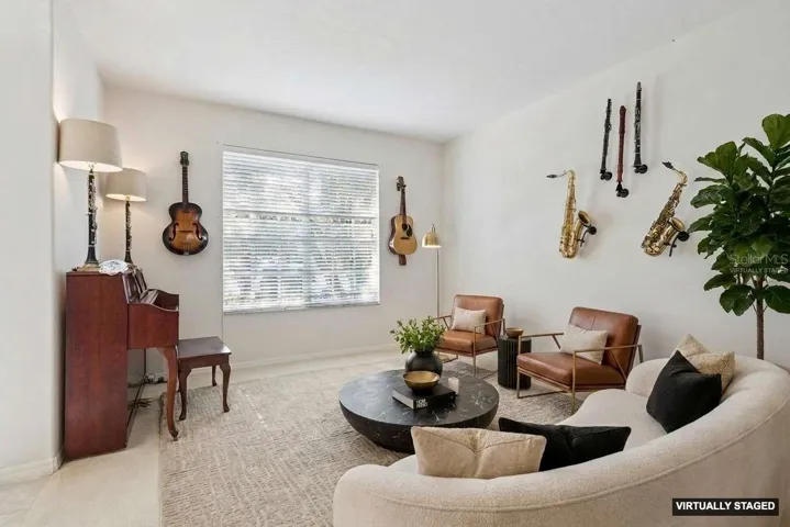 *Virtually staged* Use this space as formal living, an office or game area