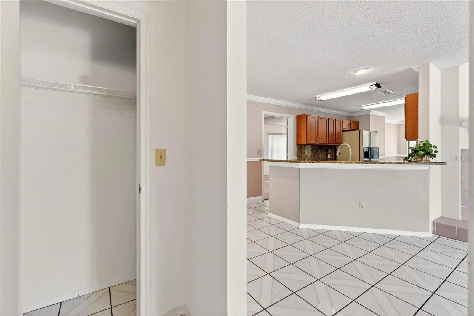 From secondary bedroom hall looking toward kitchen.