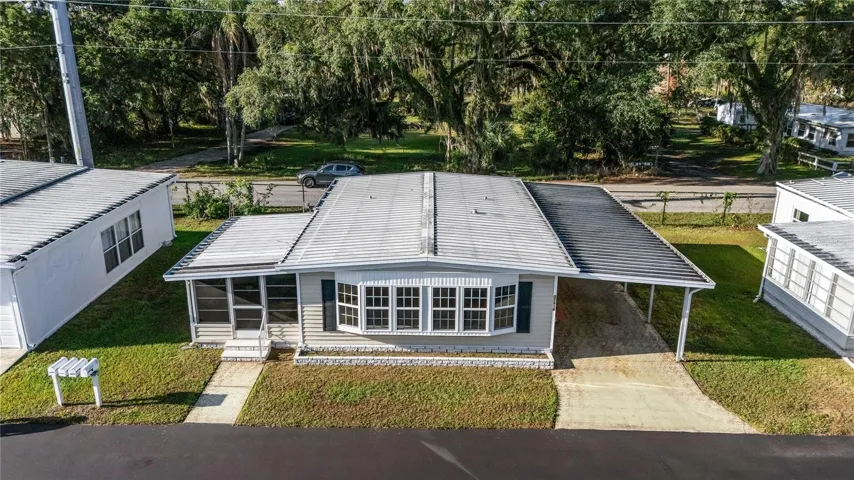 Metal roof and vinyl siding.