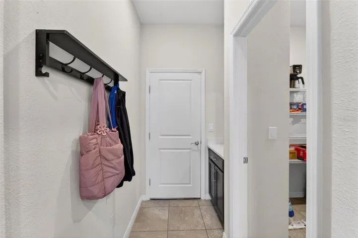 Hallway from the garage that leads to the kitchen area.