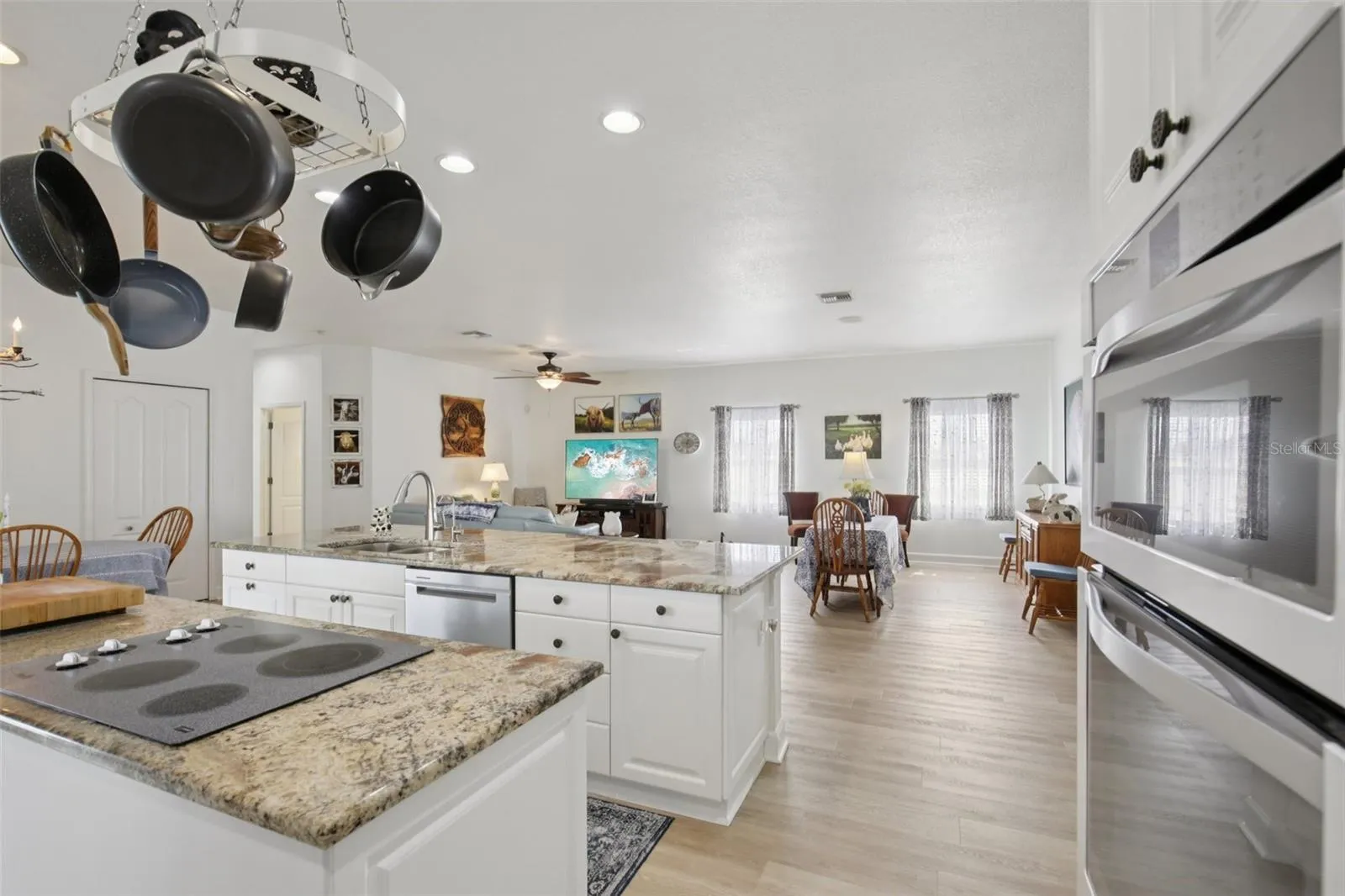 Kitchen with double island and open plan living / dining room.