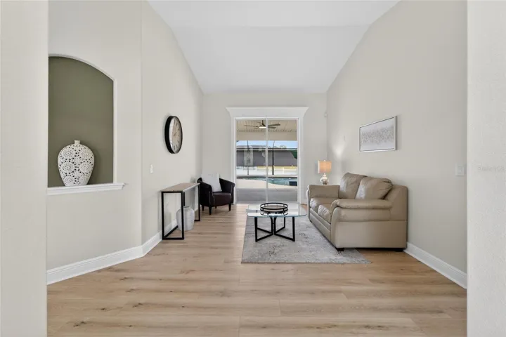 Formal Living Room or home office with sliders going out to pool