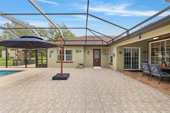 Patio Area with Door to Pool/Guest Bathroom