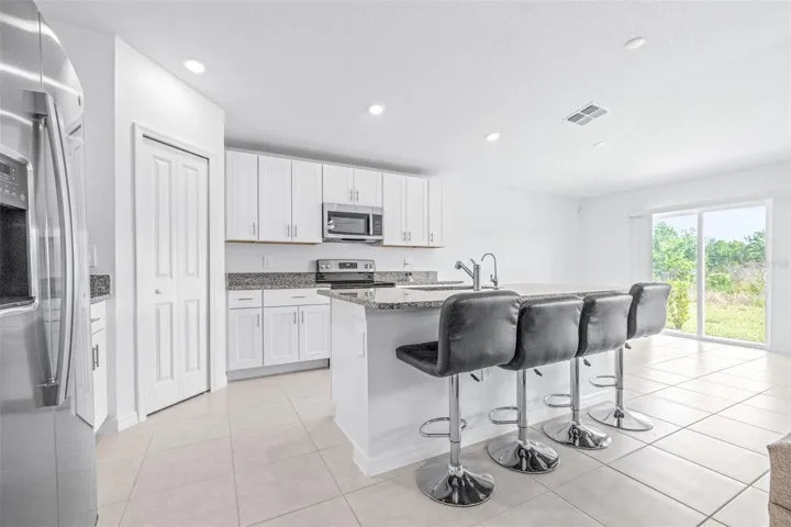 Kitchen 13x16 All Stainless Steel Appliances