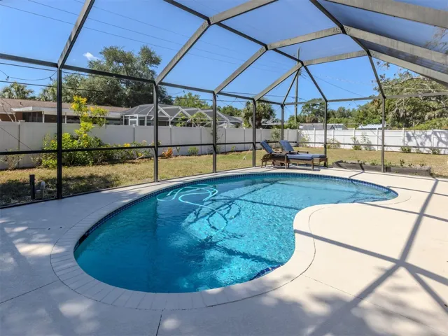 Caged pool with automatic pool cleaner