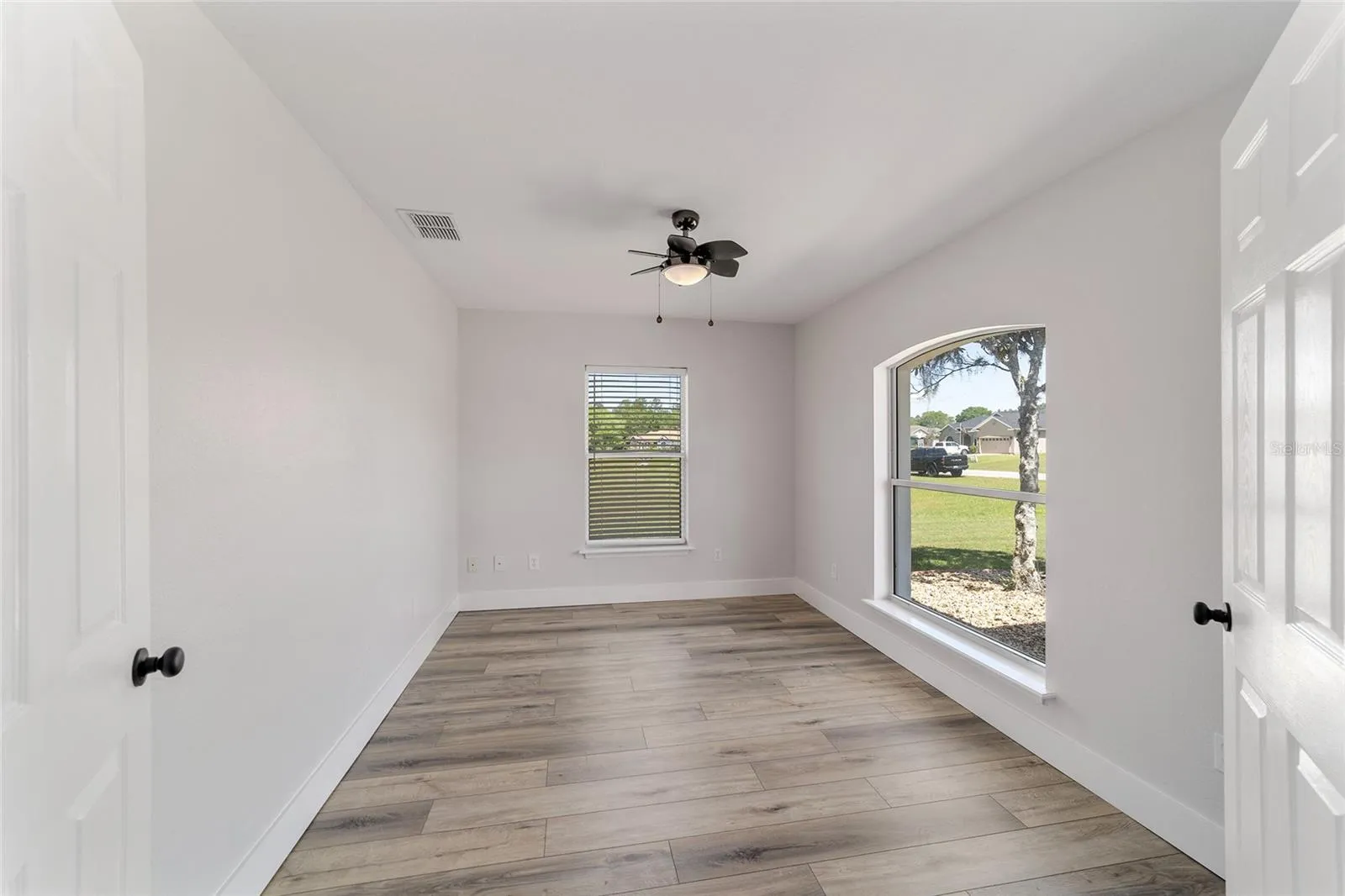 Private Office/Flex Space has French Doors and Beautiful views of Manicured Landscape