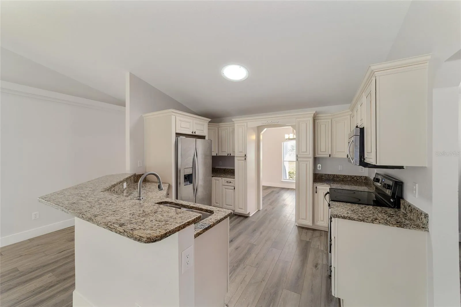 Kitchen entrance leads to the Formal Dining Room and boasts a Large Breakfast Counter