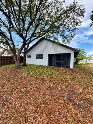 Large backyard and screened in porch.