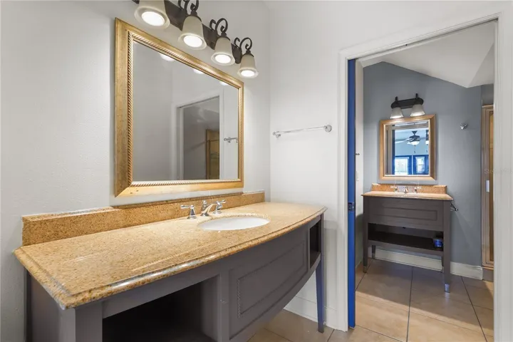 Vanity area separate from main bath. Walk in closet on other side.