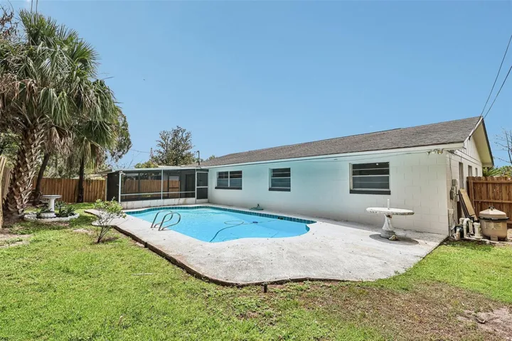 Open air pool, fenced yard.