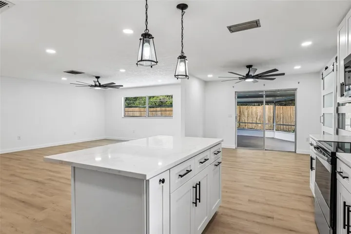 Brand new modern kitchen is open to the living and dining spaces.