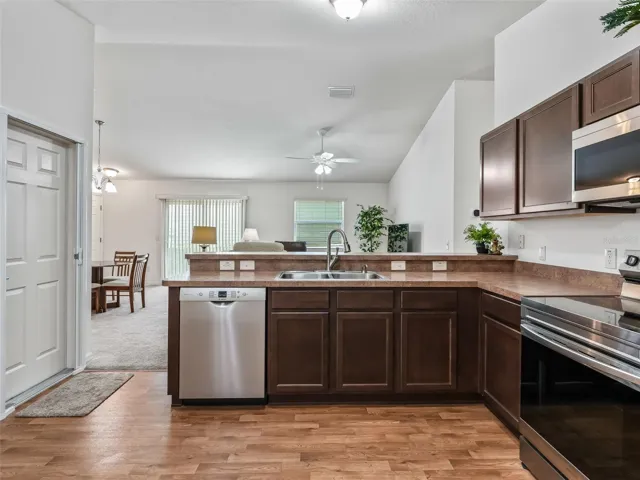 Kitchen Opens to Living & Dining area