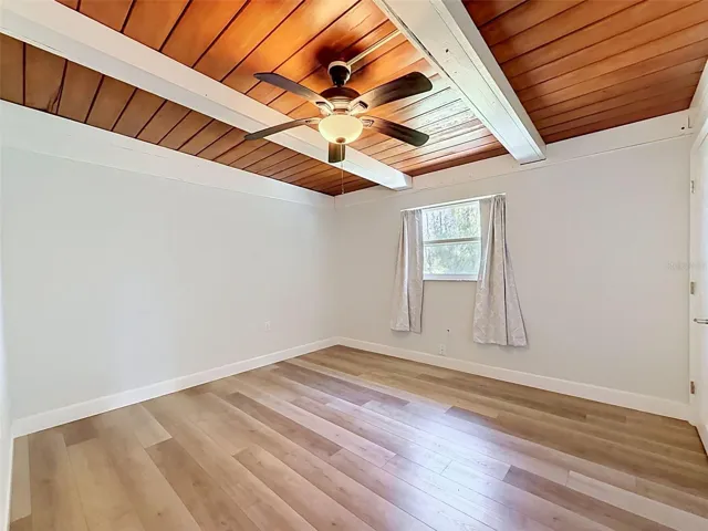 • Roomy secondary bedroom with plenty of wall space and natural light for a relaxing retreat.