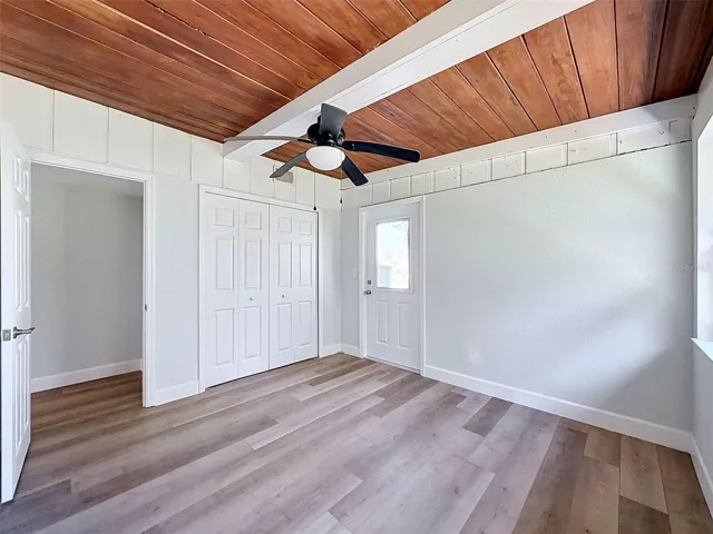 • Spacious flex room featuring private exterior access and convenient indoor laundry closet.