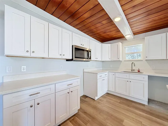 • Recessed lighting, pendant fixtures, and natural wood ceilings create a warm and inviting atmosphere.