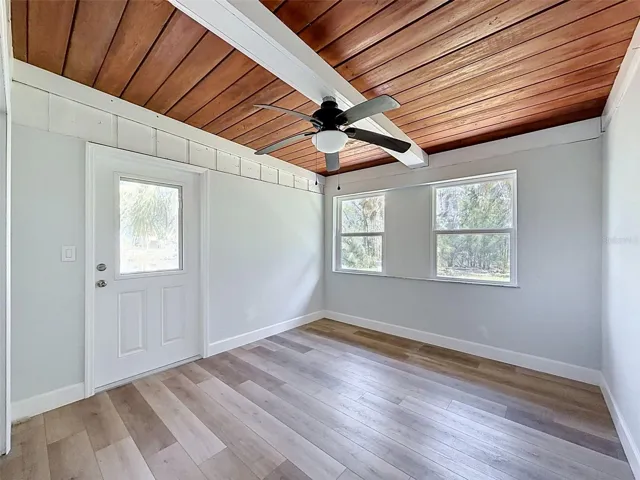 • Large flex room with washer/dryer hookups tucked behind double doors and direct outdoor access