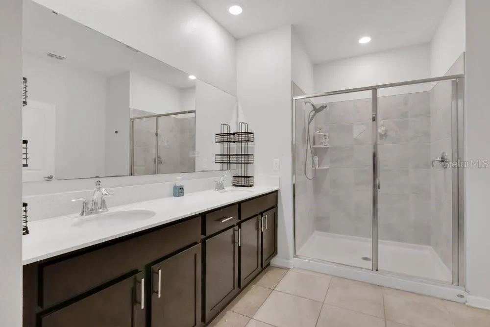 Primary Full Bathroom with a double vanity.