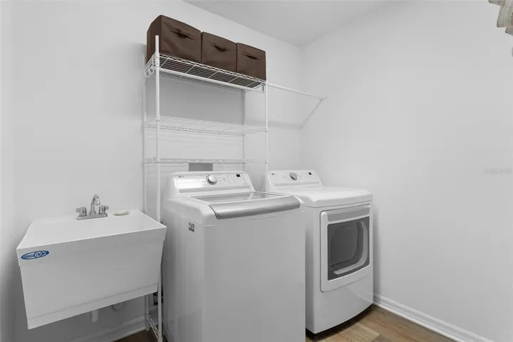 Inside Laundry room with shelving.
