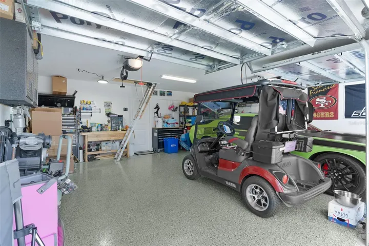 Garage Floors painted, Outlets have been added in Garage Ceiling & Aluminum Attic Stairs for attic storage.