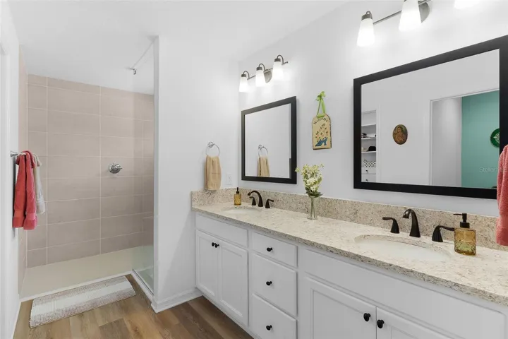 Primary Ensuite with double vanity sinks and large walk-in shower