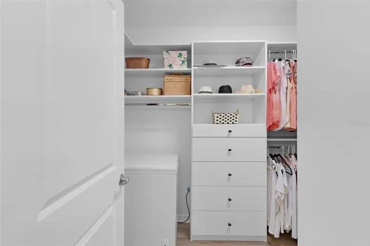 Primary Walk-in closet with upgraded Built-Ins. Triple your close space.