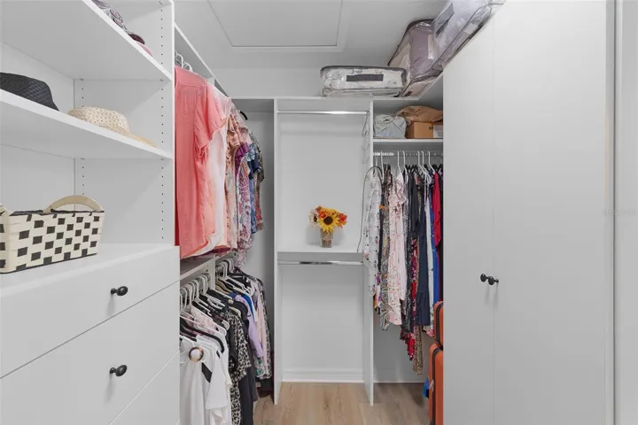 Primary Walk-in closet with custom built-ins.