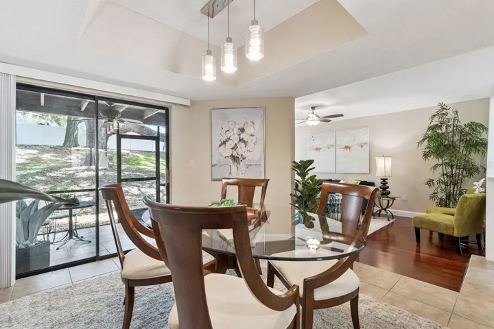 Dining Room Has Sliders out to the Screened Porch