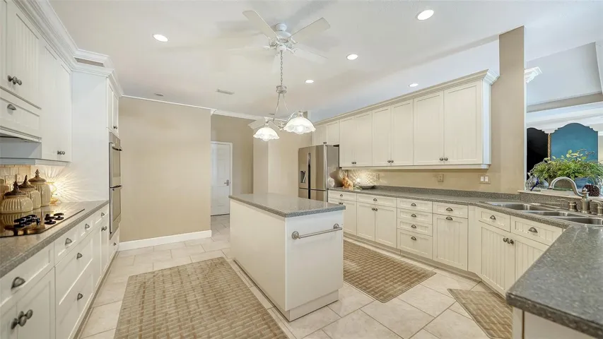 Large kitchen with all wood cabinetry and center island.