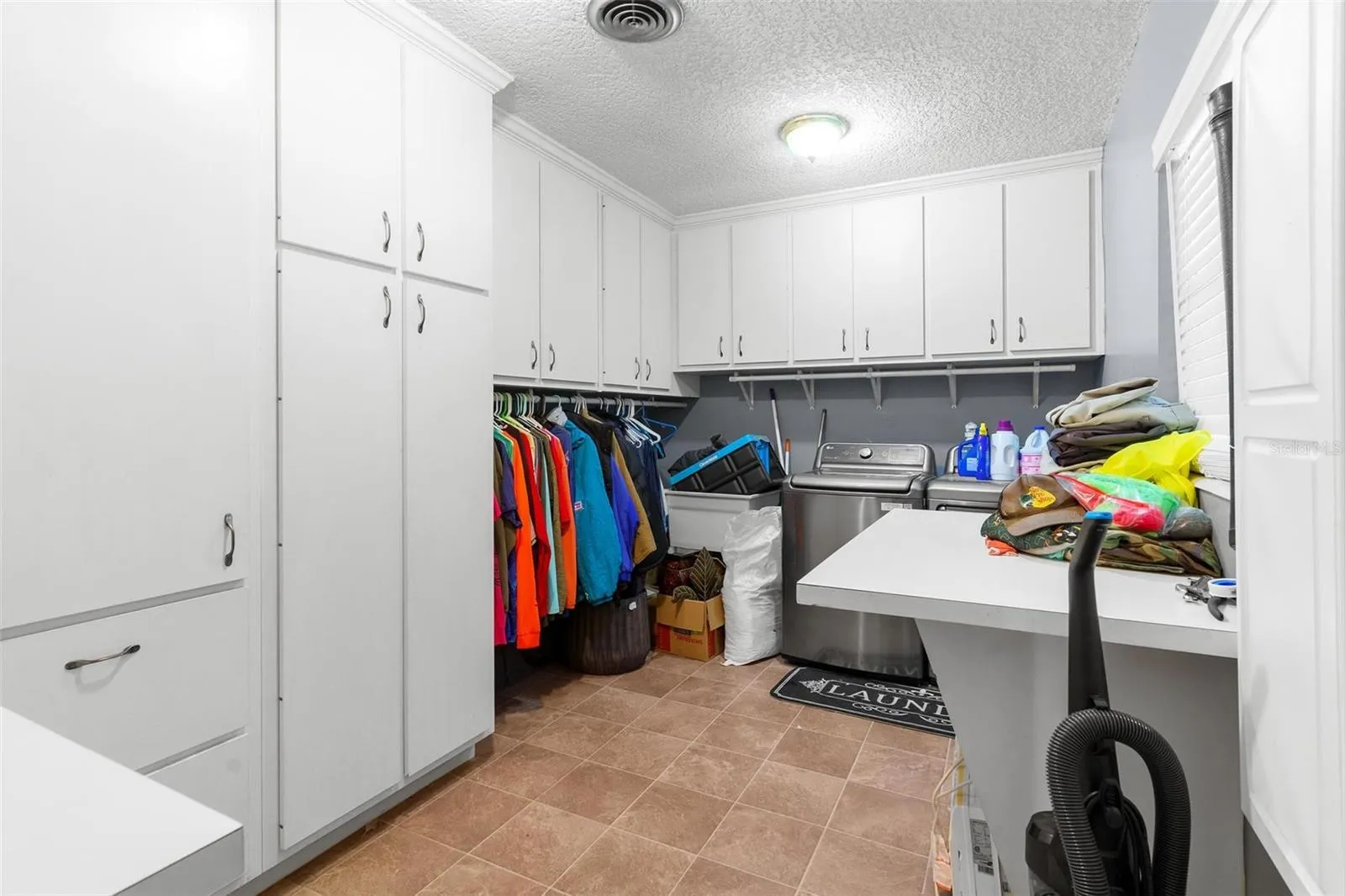 LOOK at all the storage in the laundry room!
