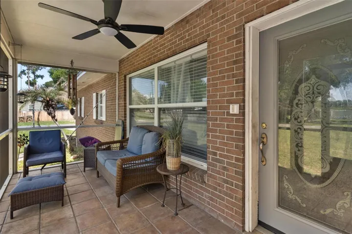 Screened front porch for relaxing or socializing