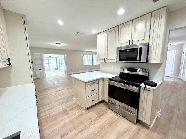Light and bright kitchen opens to the living room