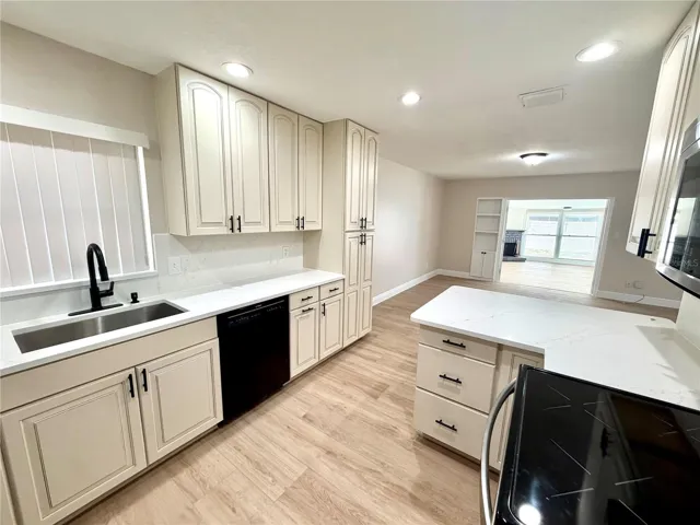 Kitchen opens up to the large living area and Florida Room