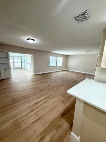 Light and bright kitchen opens to the living room