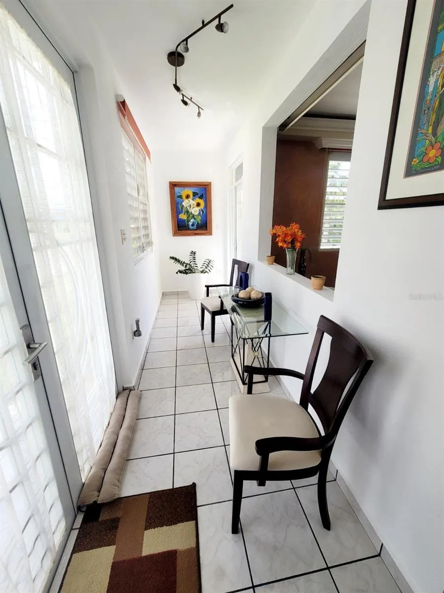 Hacienda del Dorado, Dorado, Puerto Rico property offering 4 bedrooms, 2.5 bathrooms, 2,500 sq. ft. of living space on a 3,947 sq. meter lot. Gated community with 24-hour security and excellent access to main roads in Dorado. Spacious layout with double carport for 4 vehicles and lower-level areas with plumbing and electrical ready for future conversion. Large lot provides privacy and expansion potential in a prime Dorado residential location.