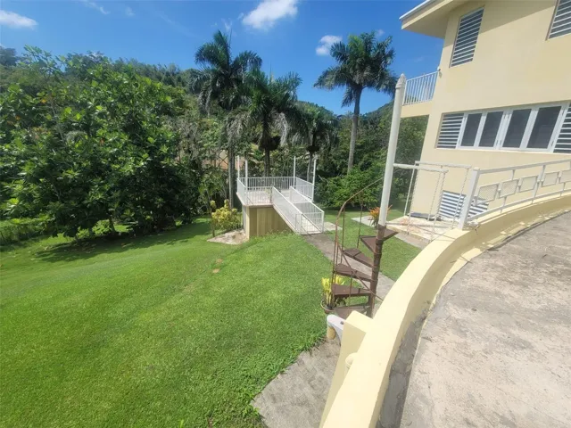 Hacienda del Dorado, Dorado, Puerto Rico property offering 4 bedrooms, 2.5 bathrooms, 2,500 sq. ft. of living space on a 3,947 sq. meter lot. Gated community with 24-hour security and excellent access to main roads in Dorado. Spacious layout with double carport for 4 vehicles and lower-level areas with plumbing and electrical ready for future conversion. Large lot provides privacy and expansion potential in a prime Dorado residential location.
