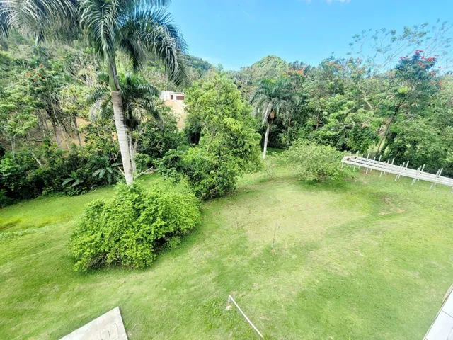 Hacienda del Dorado, Dorado, Puerto Rico property offering 4 bedrooms, 2.5 bathrooms, 2,500 sq. ft. of living space on a 3,947 sq. meter lot. Gated community with 24-hour security and excellent access to main roads in Dorado. Spacious layout with double carport for 4 vehicles and lower-level areas with plumbing and electrical ready for future conversion. Large lot provides privacy and expansion potential in a prime Dorado residential location.