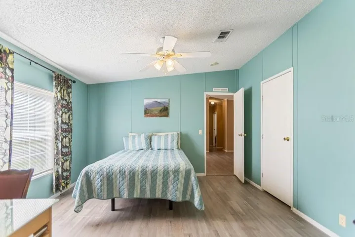 primary bedroom with walk-in closet
