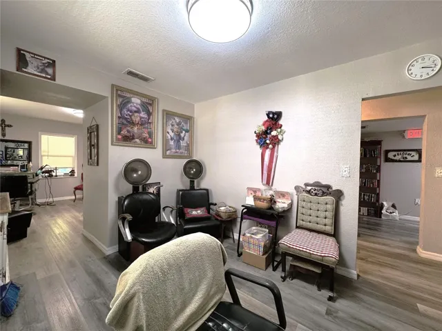 SALON #2 IN UNIT "A" LOOKING TO MAIN ACCESSIBLE BATHROOM & HALL