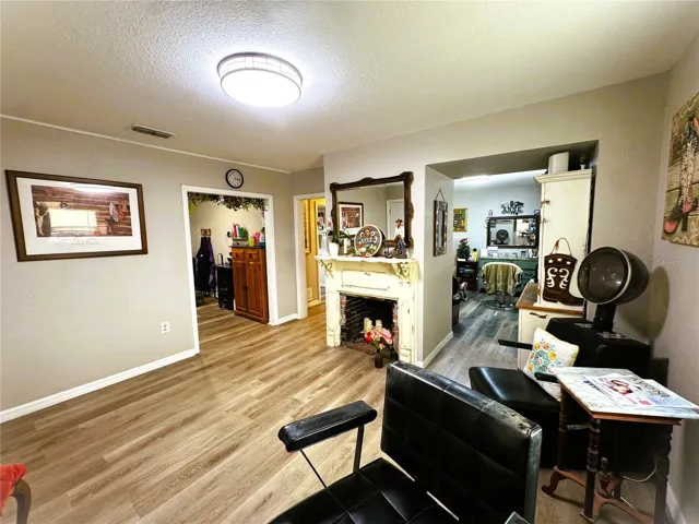 LOOKING FROM SALON UNIT "A" TO ENTRANCE OF UNIT "B" AND HALLWAY TO BATH AND SALON #2 IN UNNIT "A"