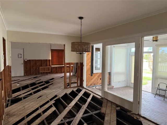 Dining room overlooking the enclosed porch and water views