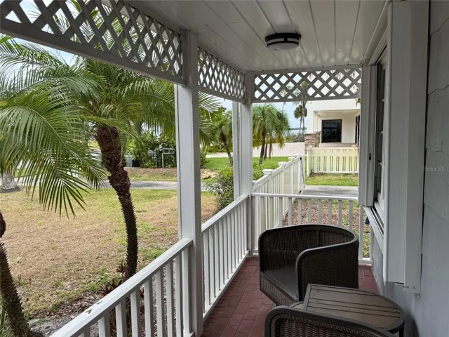 Covered front porch with water views