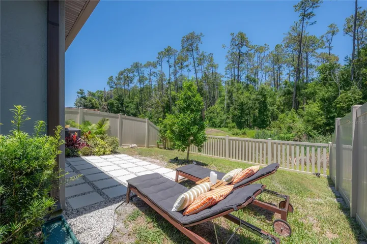 Fenced backyard with lounge area