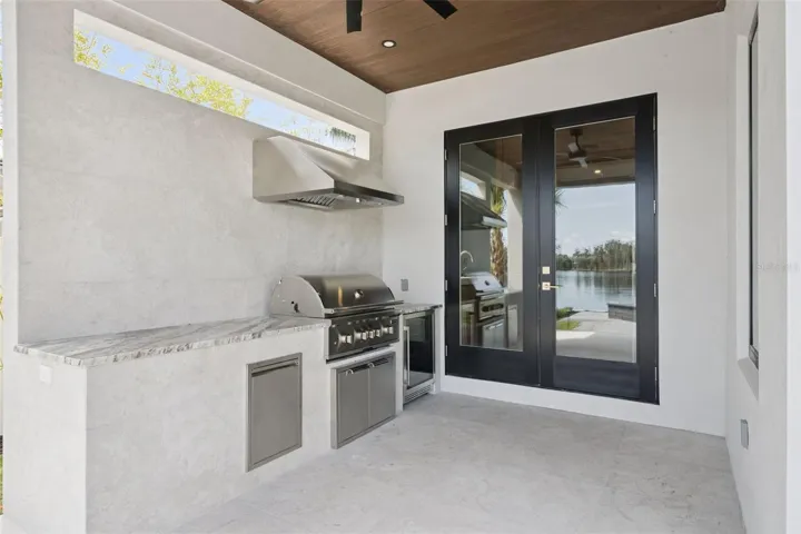 Outdoor Kitchen featuring grill and refrigerator
