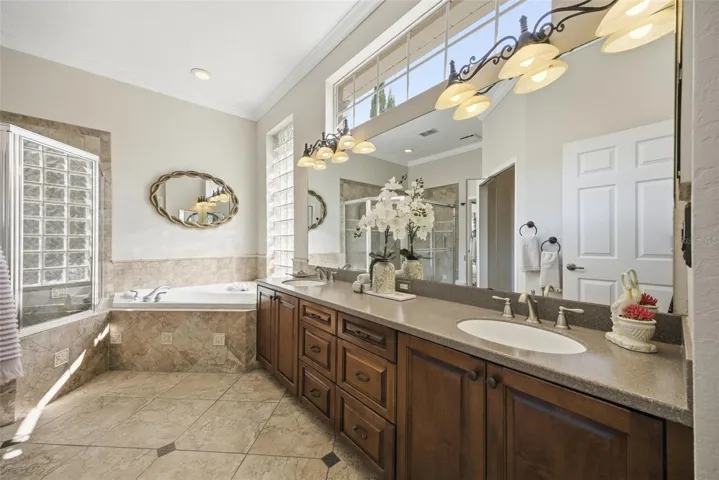 PRIMARY BATH HAS PLENTY OF STORAGE, COUNTER SPACE & DOUBLE SINKS