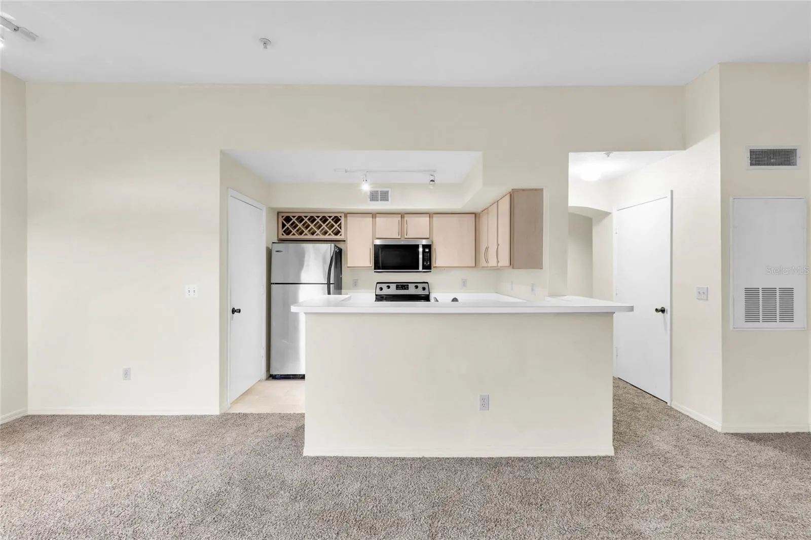 Living room facing kitchen