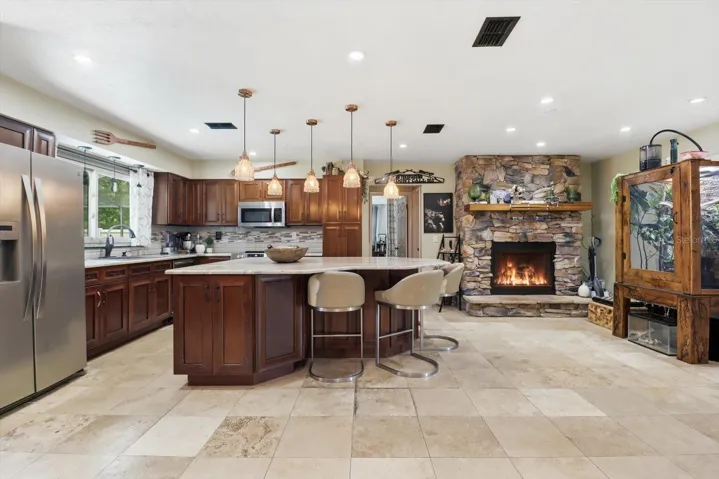 Living area & kitchen - complete with a stone gas fireplace